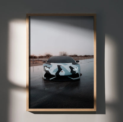 Lamborghini Huracan poster with sleek front view in muted outdoor setting, modern wall art.