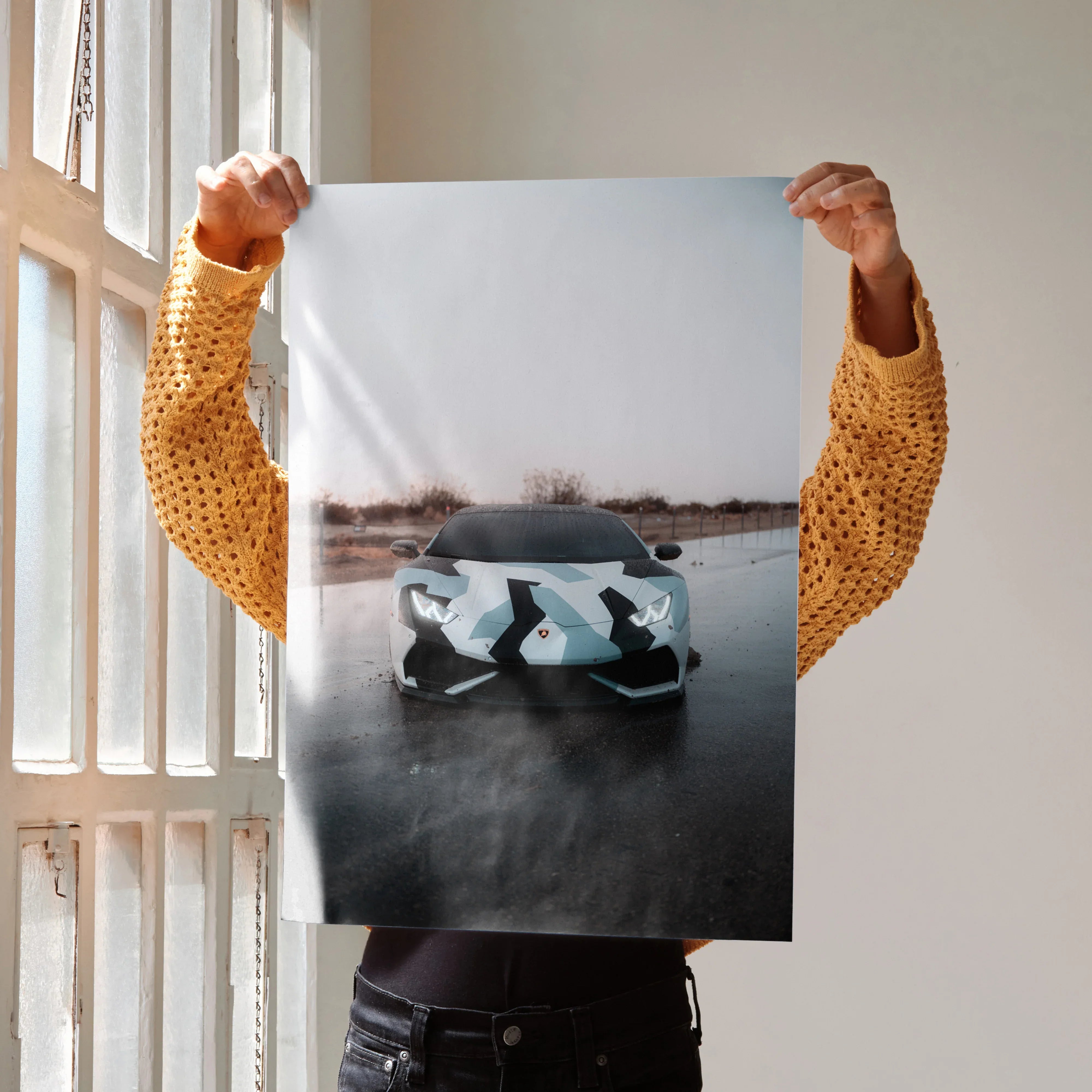 Lamborghini Huracan poster wall art with sleek black and white camo sports car on reflective surface.