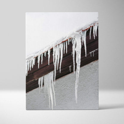 Canvas wall art featuring close-up of clear icicles hanging from dark wooden roof edge against snow-white background.