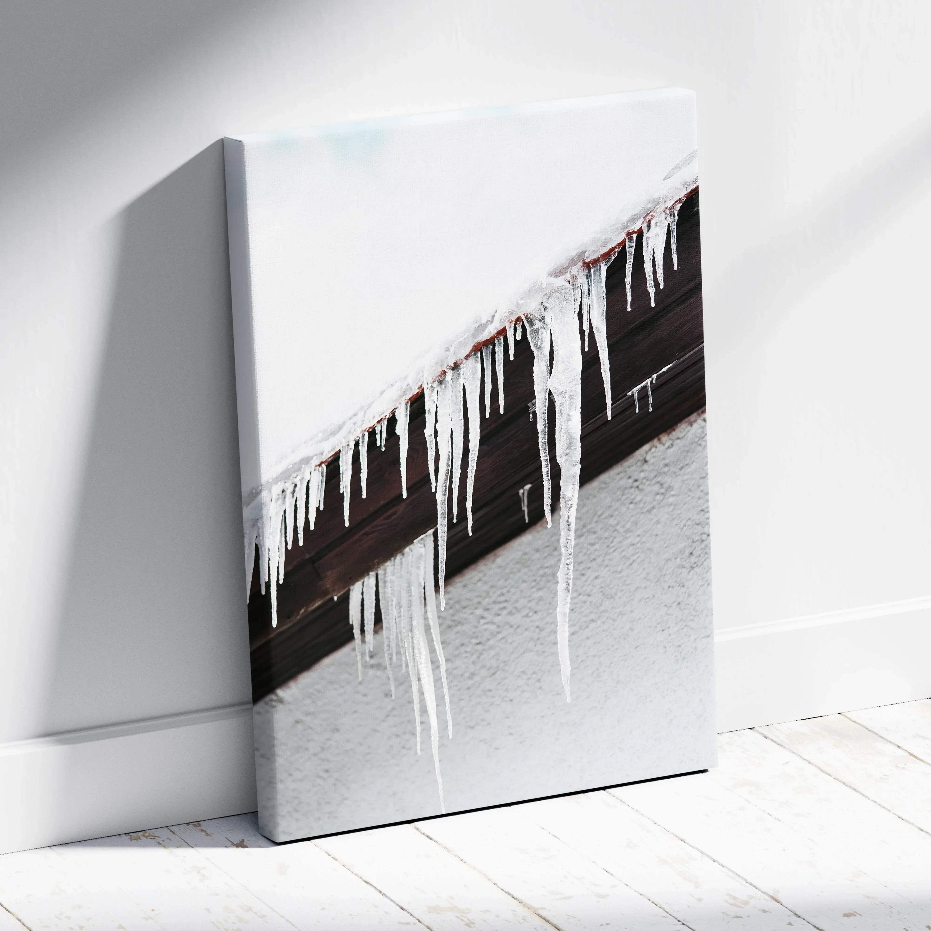 Canvas wall art featuring close-up of roof icicles with snow on textured white wall background.