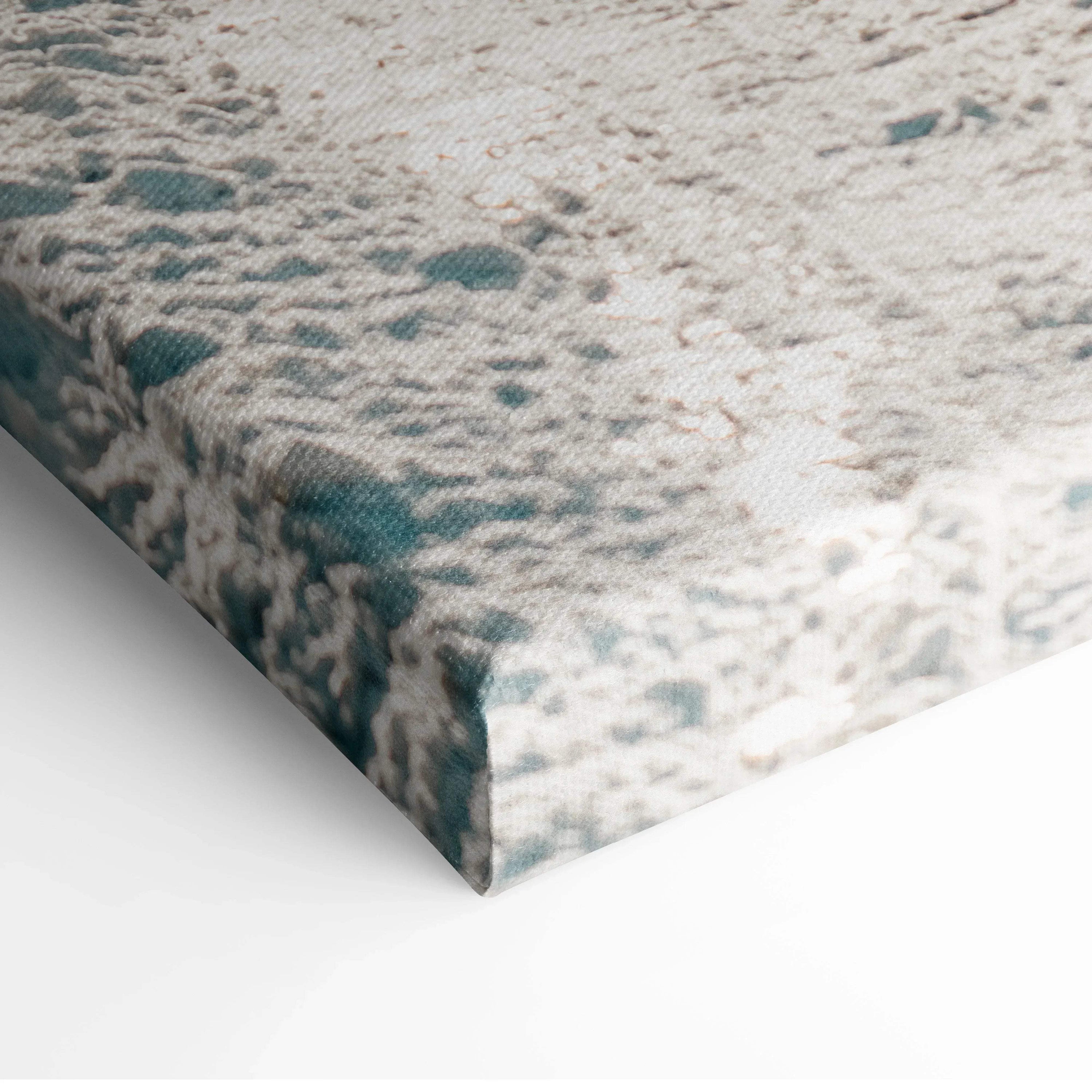 Close-up of textured canvas wall art featuring a snowy road with soft blue and white tones.