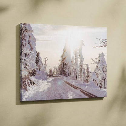 Winter landscape canvas wall art with snow-covered trees and a sunlit path, serene decor.