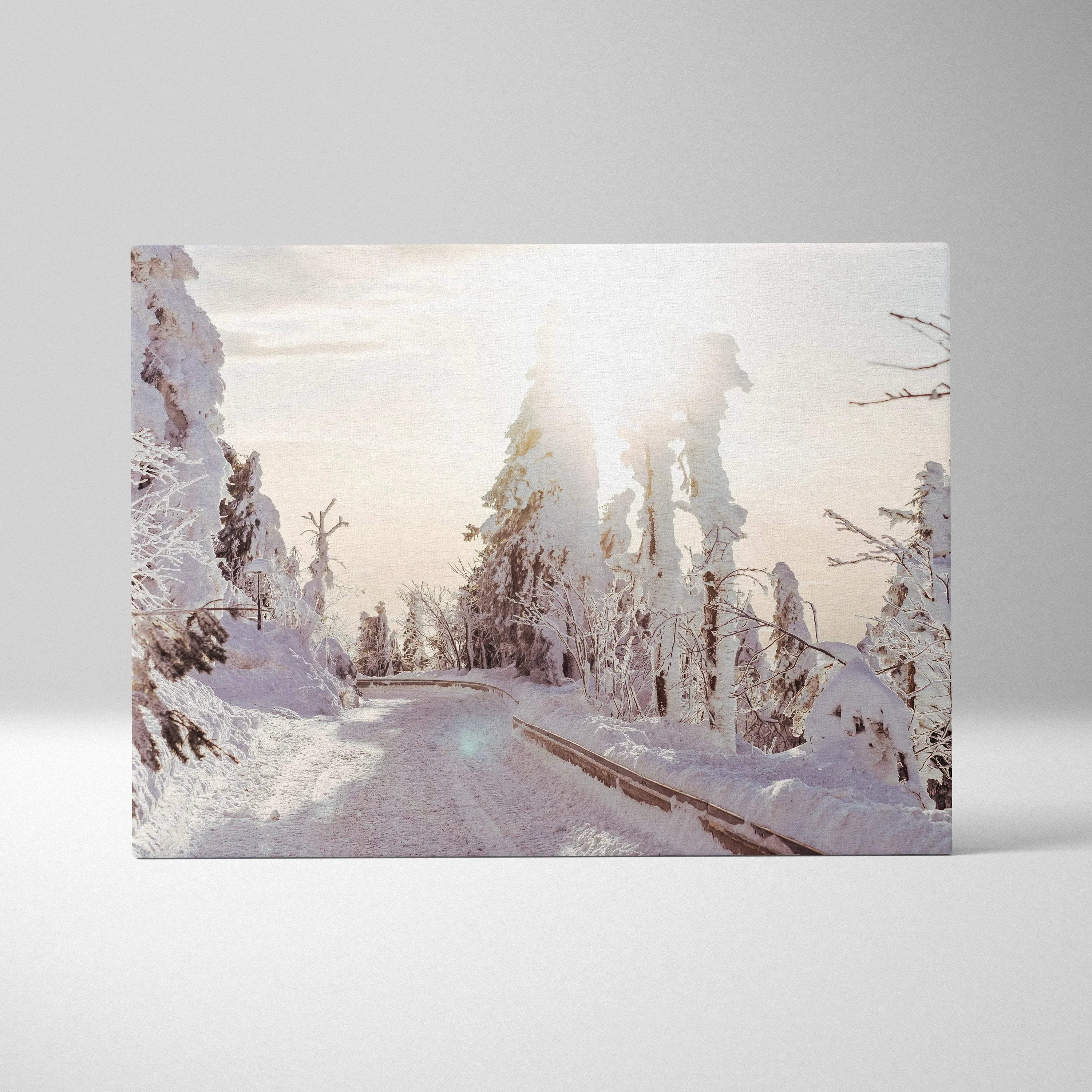 Winter landscape canvas wall art with snowy trees and soft sunlight glow.