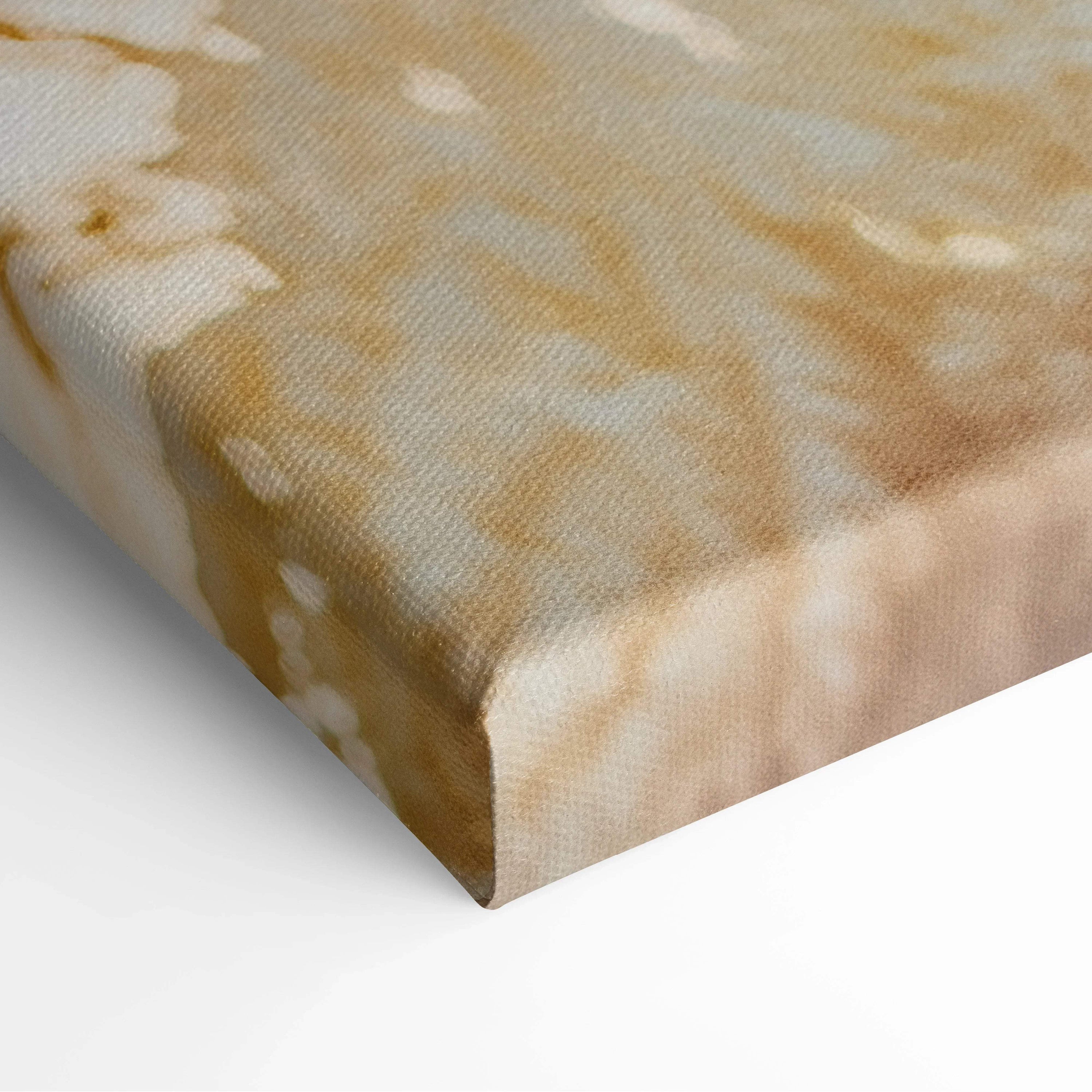 Close-up of textured canvas wall art with warm beige and white abstract winter design.