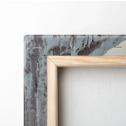 Close-up of canvas wall art corner with natural wooden frame and textured winter scene featuring blue-gray icicles and snow.
