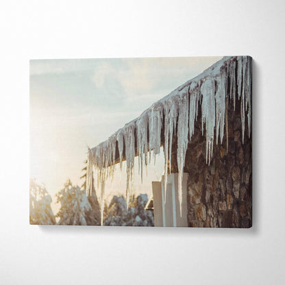 Canvas wall art featuring winter scene with glistening icicles hanging from a rustic roof edge.