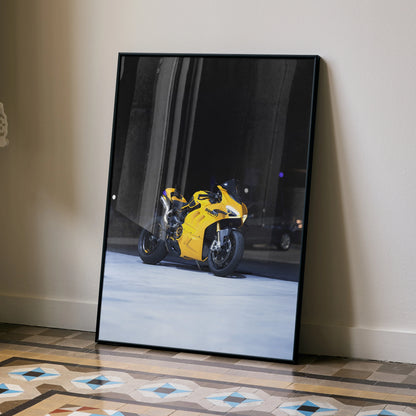 Yellow Ducati Panigale V4S motorcycle poster leaning against wall on patterned floor wall art.