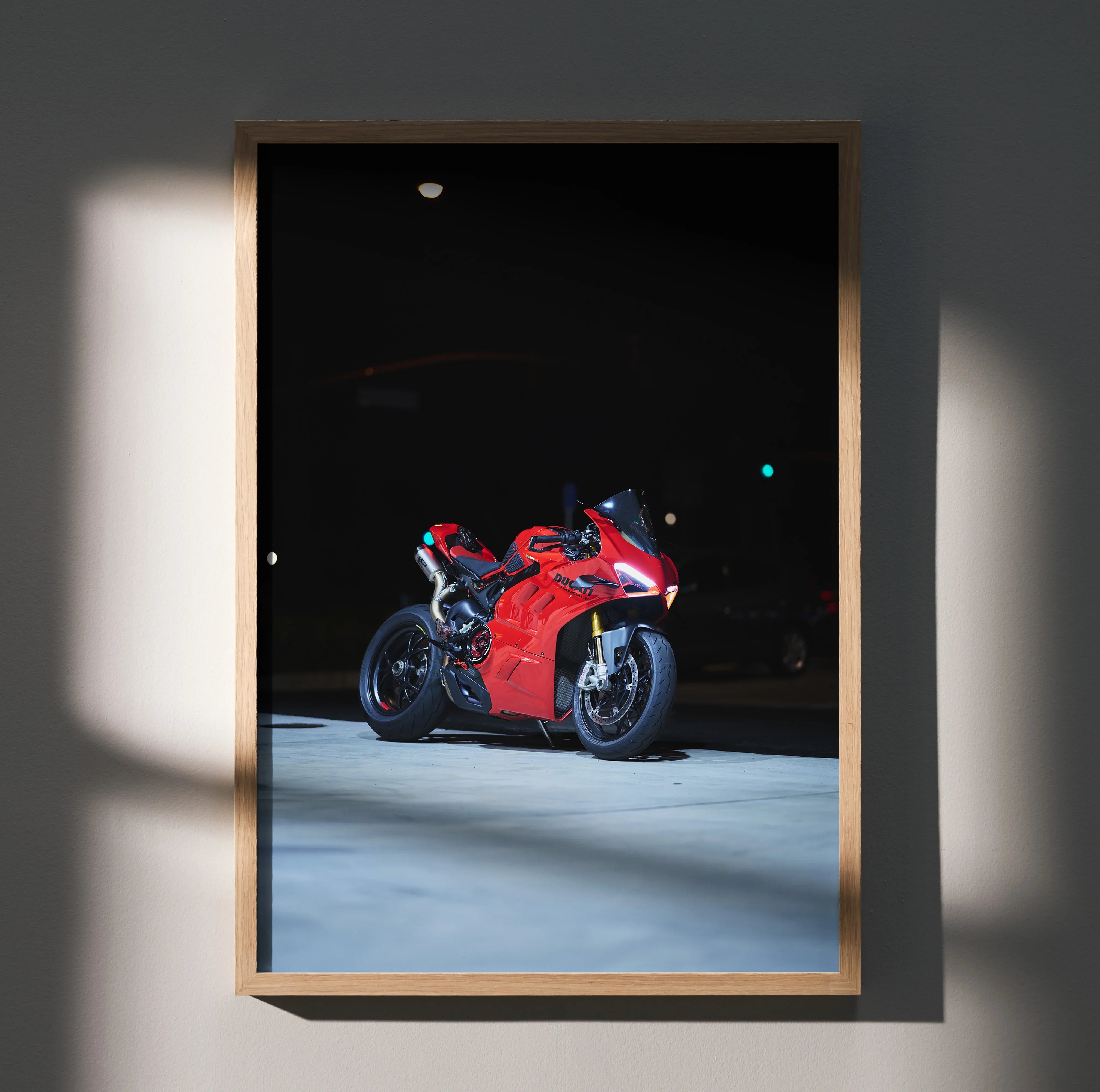 Ducati Panigale V4S red sport motorcycle poster framed as wall art in soft lighting.