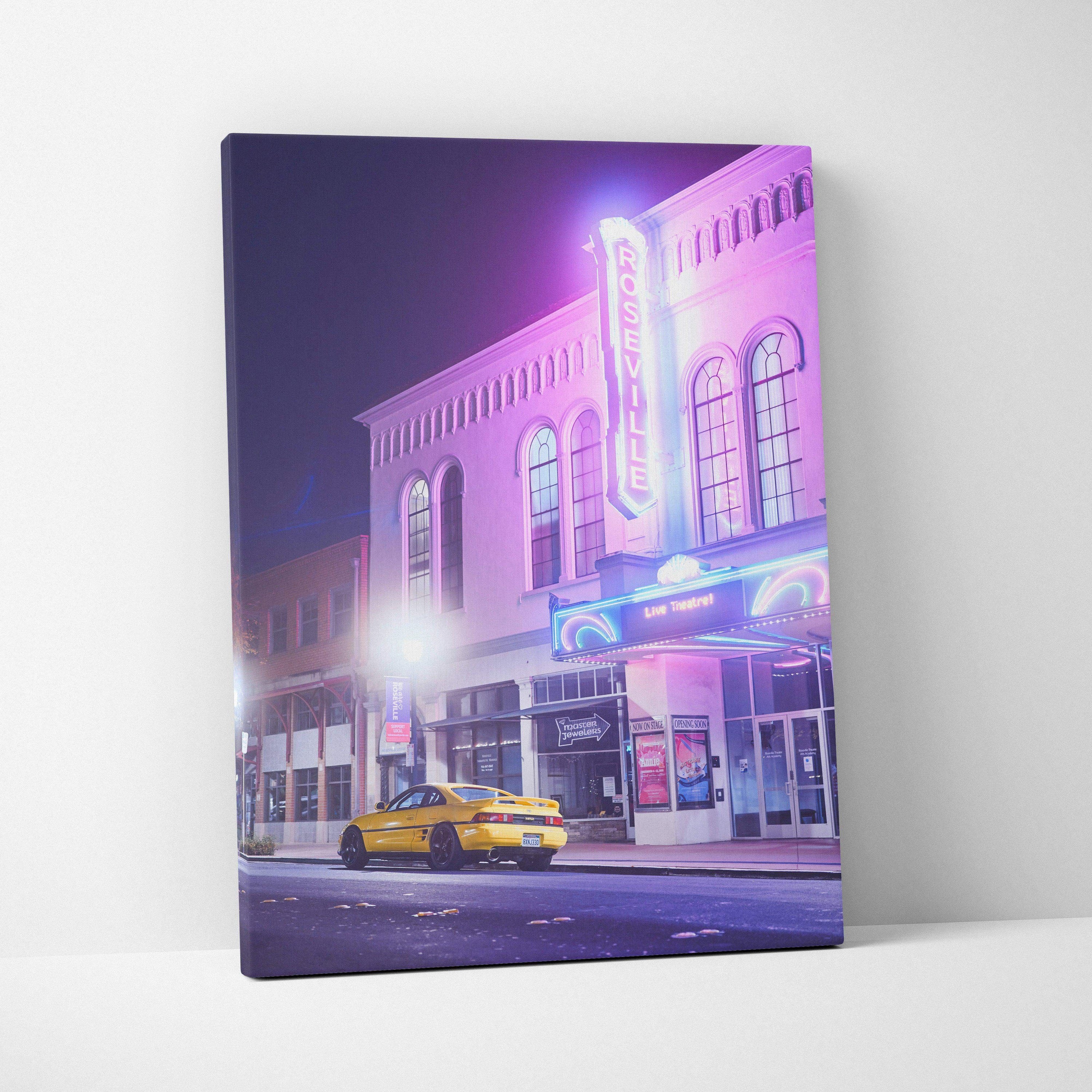 Vertical canvas art featuring a yellow Toyota MR2 parked under vibrant neon lights on a city street at night.