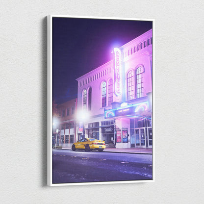 Toyota MR2 canvas wall art featuring a glowing neon theater and yellow sports car at night.