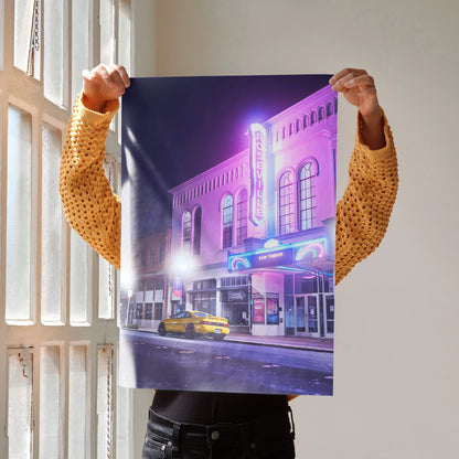 Toyota MR2 poster wall art with neon-lit classic theater and yellow car at night.