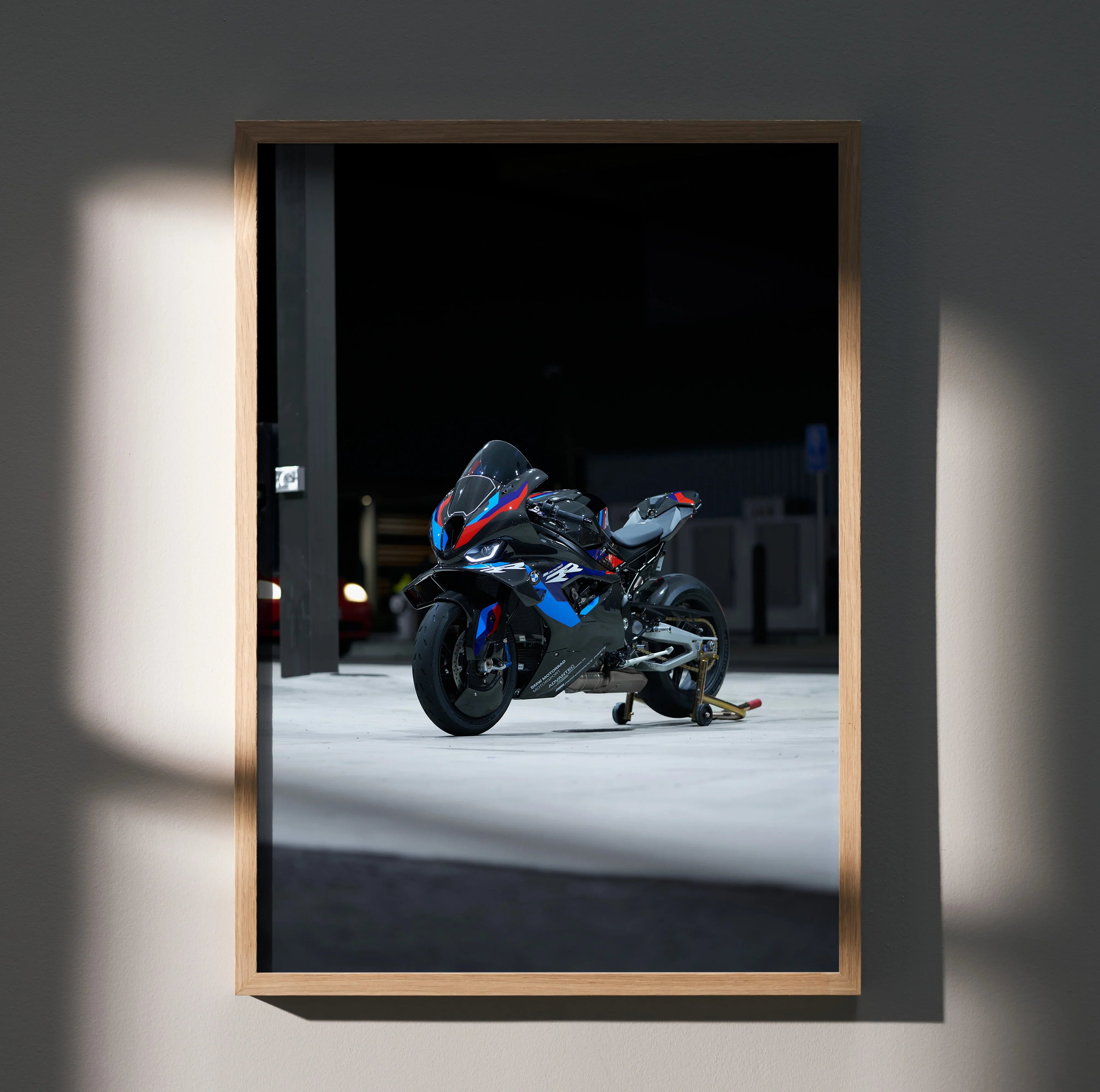 BMW M1000RR motorcycle art print poster with sleek black and blue racing design on wall art.