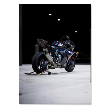 BMW M1000RR motorcycle poster with vibrant blue, red, and white accents on sleek black wall art.