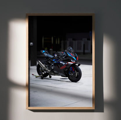 BMW M1000RR motorcycle poster wall art with sleek black and blue racing design in wooden frame.