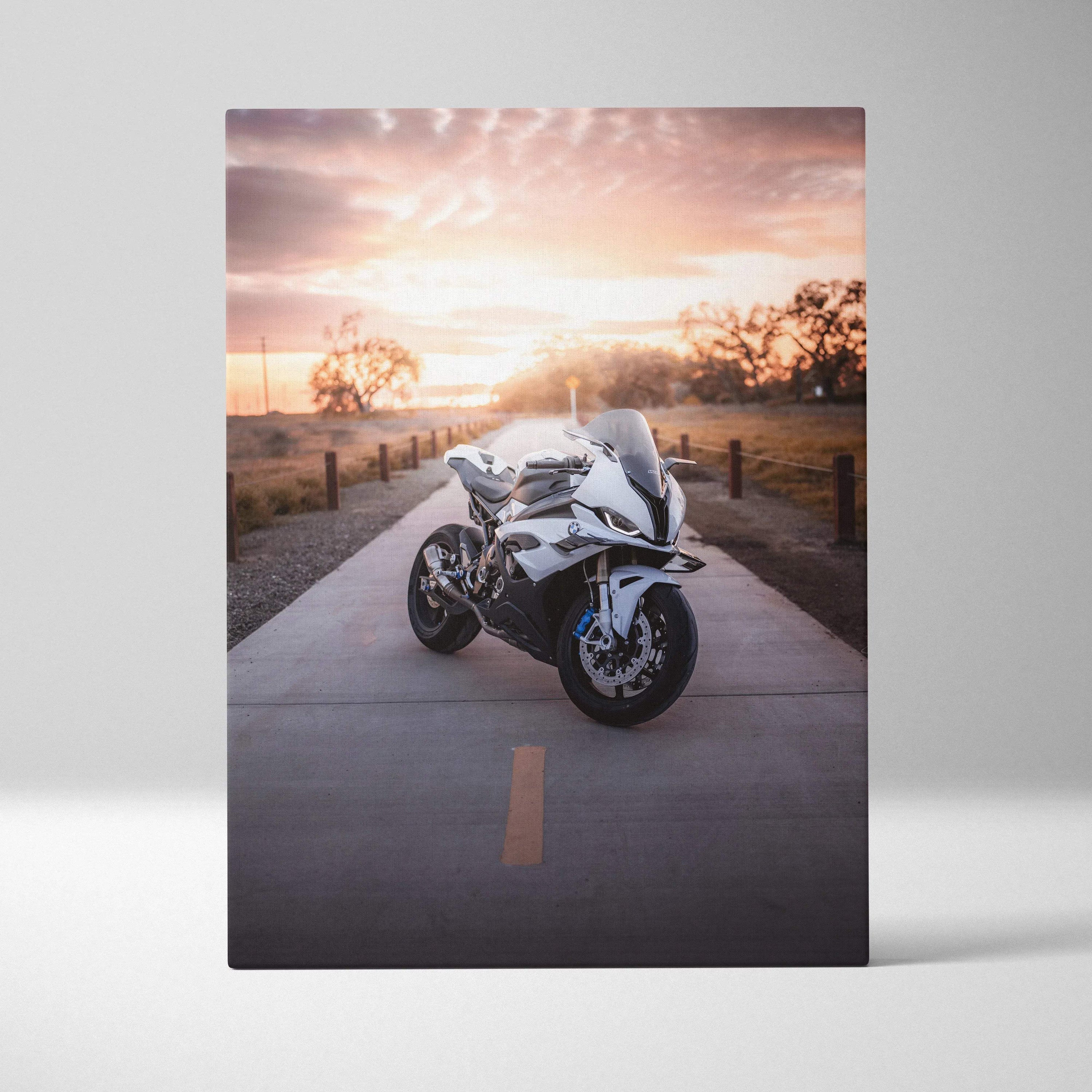 BMW S1000RR motorcycle on road at sunset canvas wall art with warm sky background.