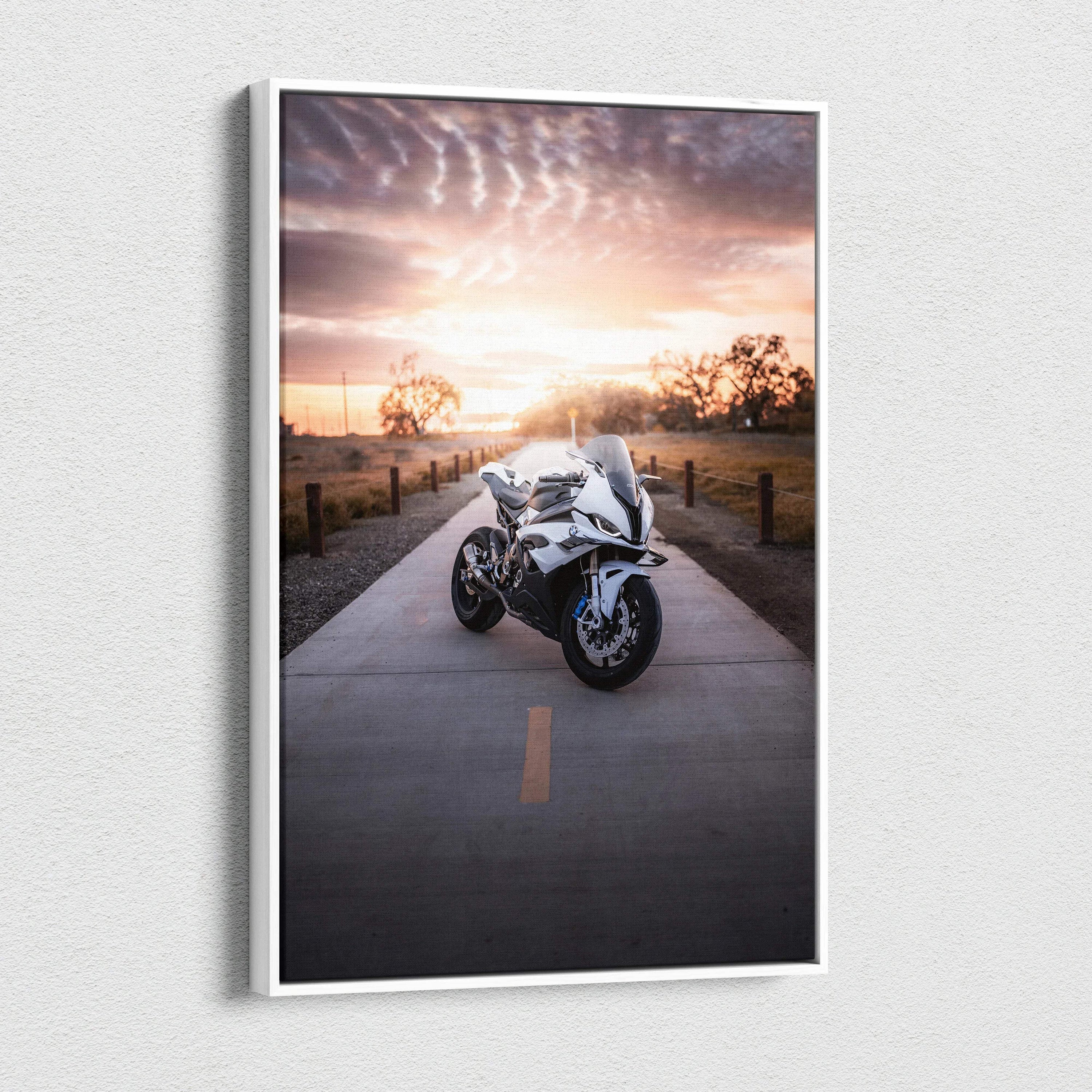 Vertical canvas wall art featuring a BMW S1000RR motorcycle on a sunset road with dramatic sky.