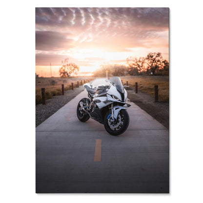 BMW S1000RR motorcycle poster on road at sunset, sleek white bike wall art with vibrant sky.