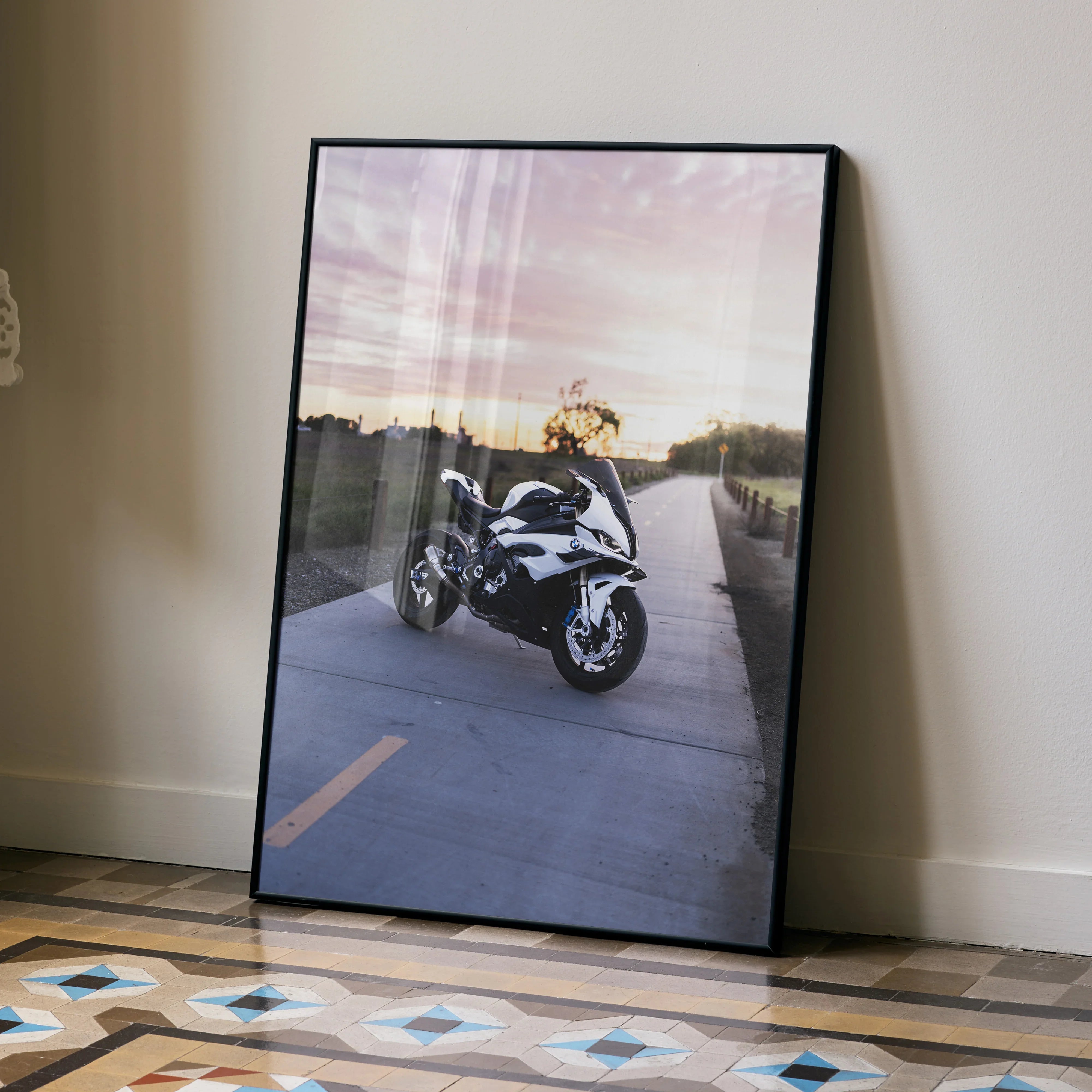 BMW S1000RR motorcycle poster with sunset background in sleek black frame wall art.