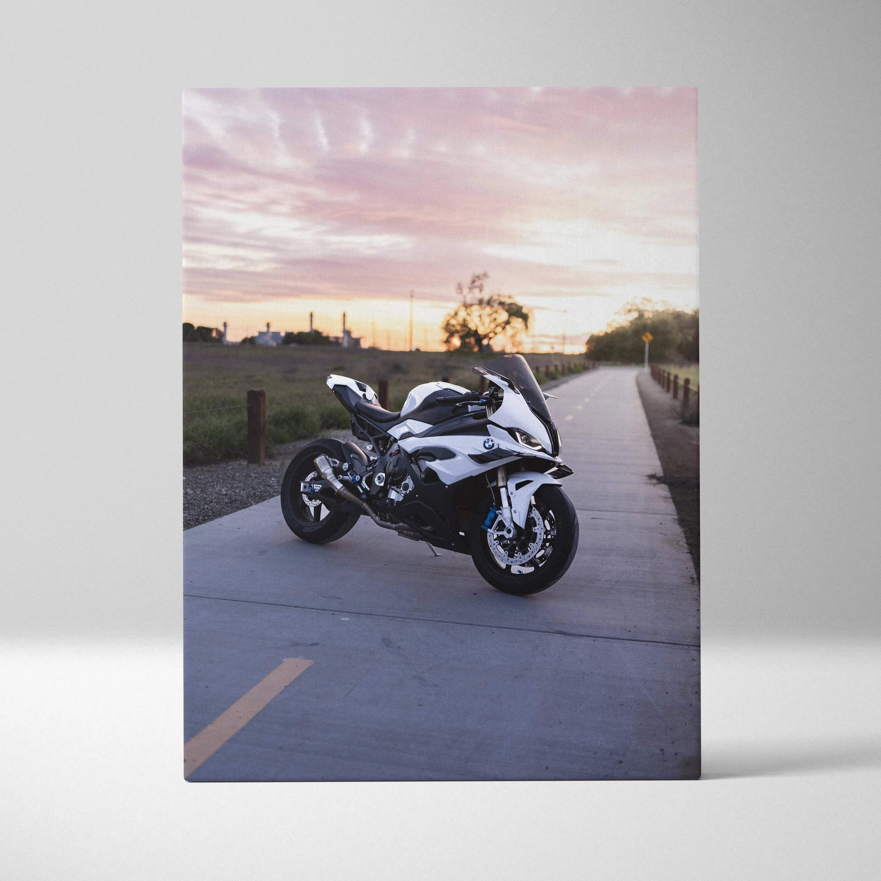 BMW S1000RR motorcycle against a sunset sky on canvas wall art with vertical orientation.