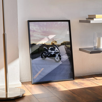 BMW S1000RR motorcycle poster with sunset backdrop in sleek black frame wall art.