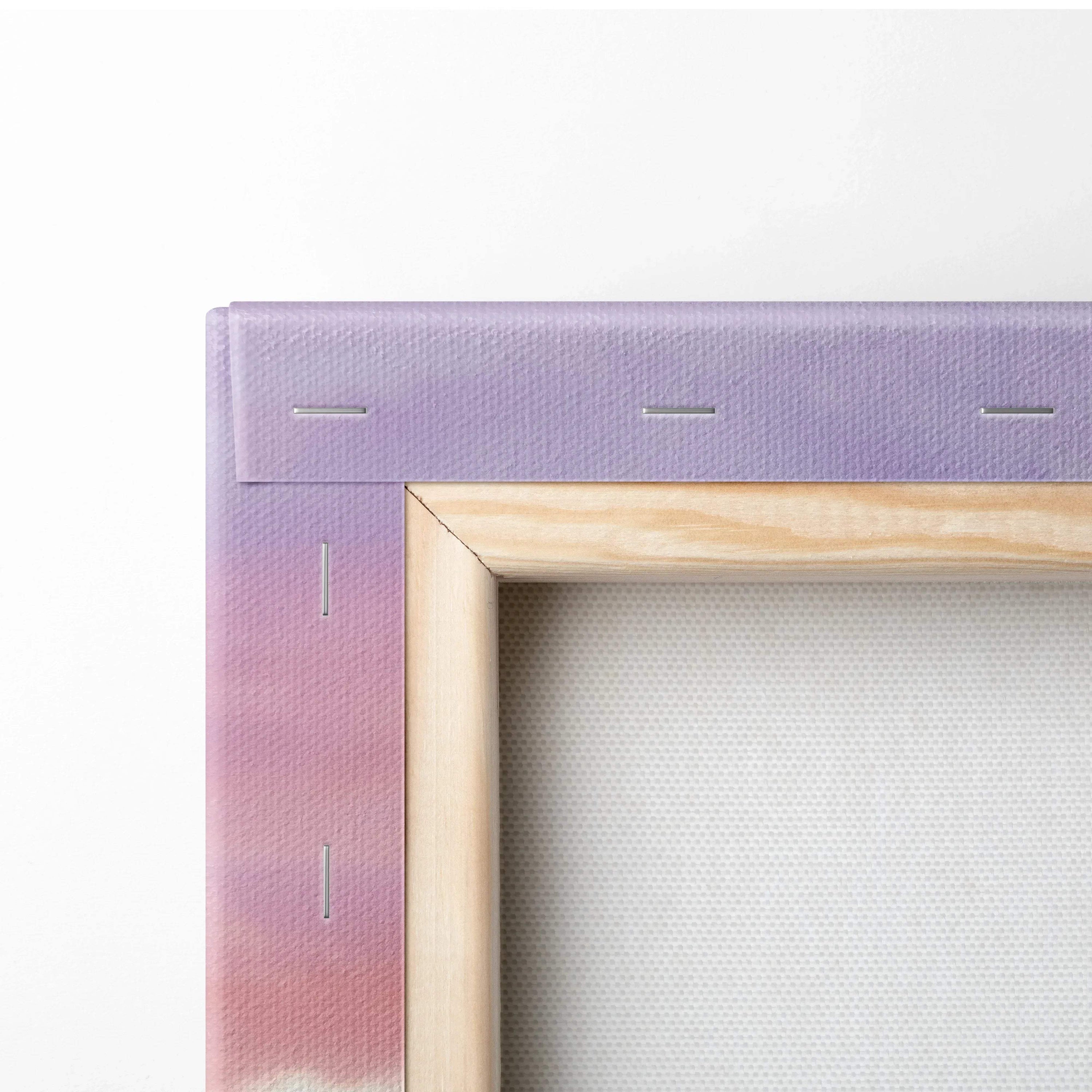 Close-up of stretched canvas art corner with wooden frame and purple-pink gradient wall art.