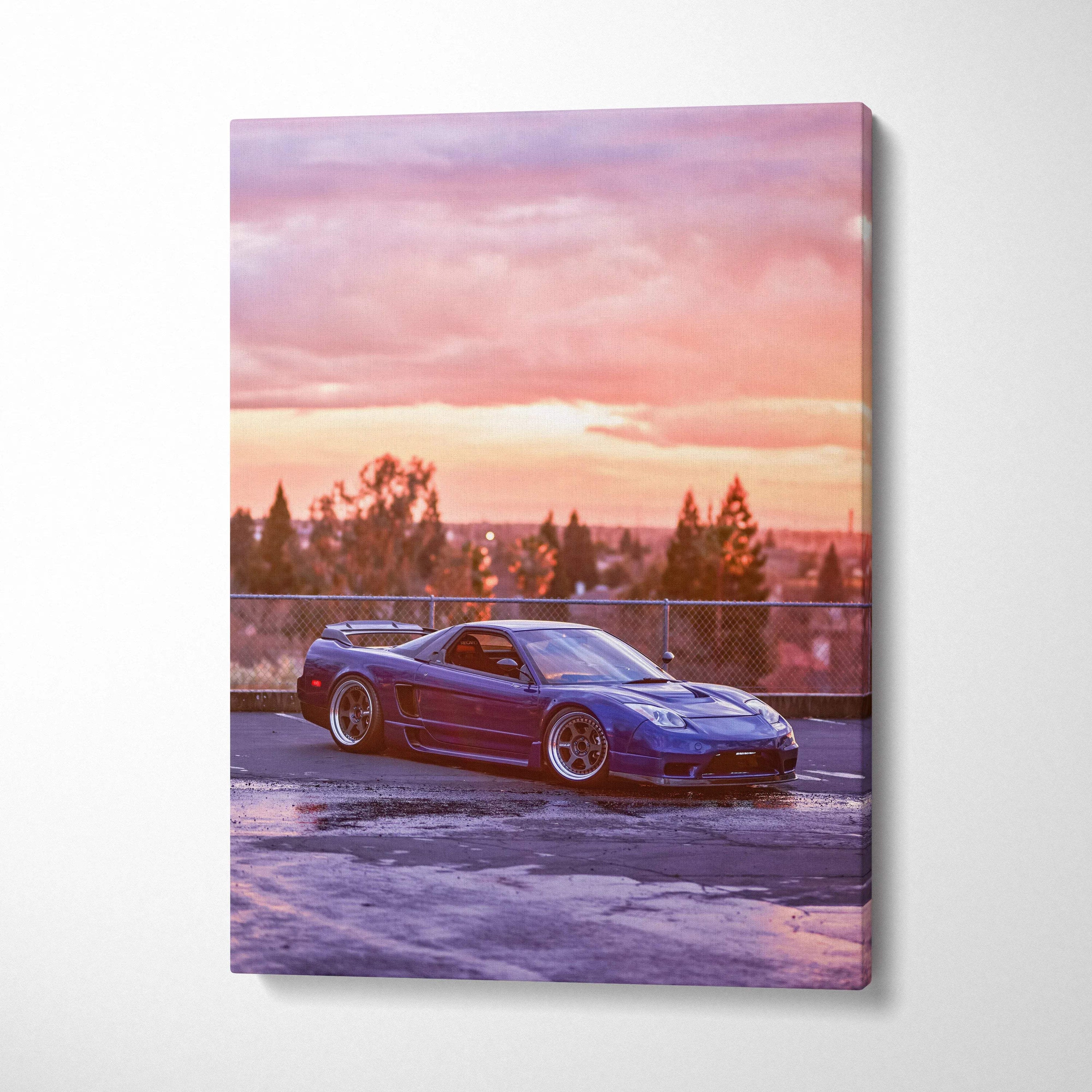 Acura NSX sports car at sunset on vertical canvas wall art with vibrant pink and purple sky.