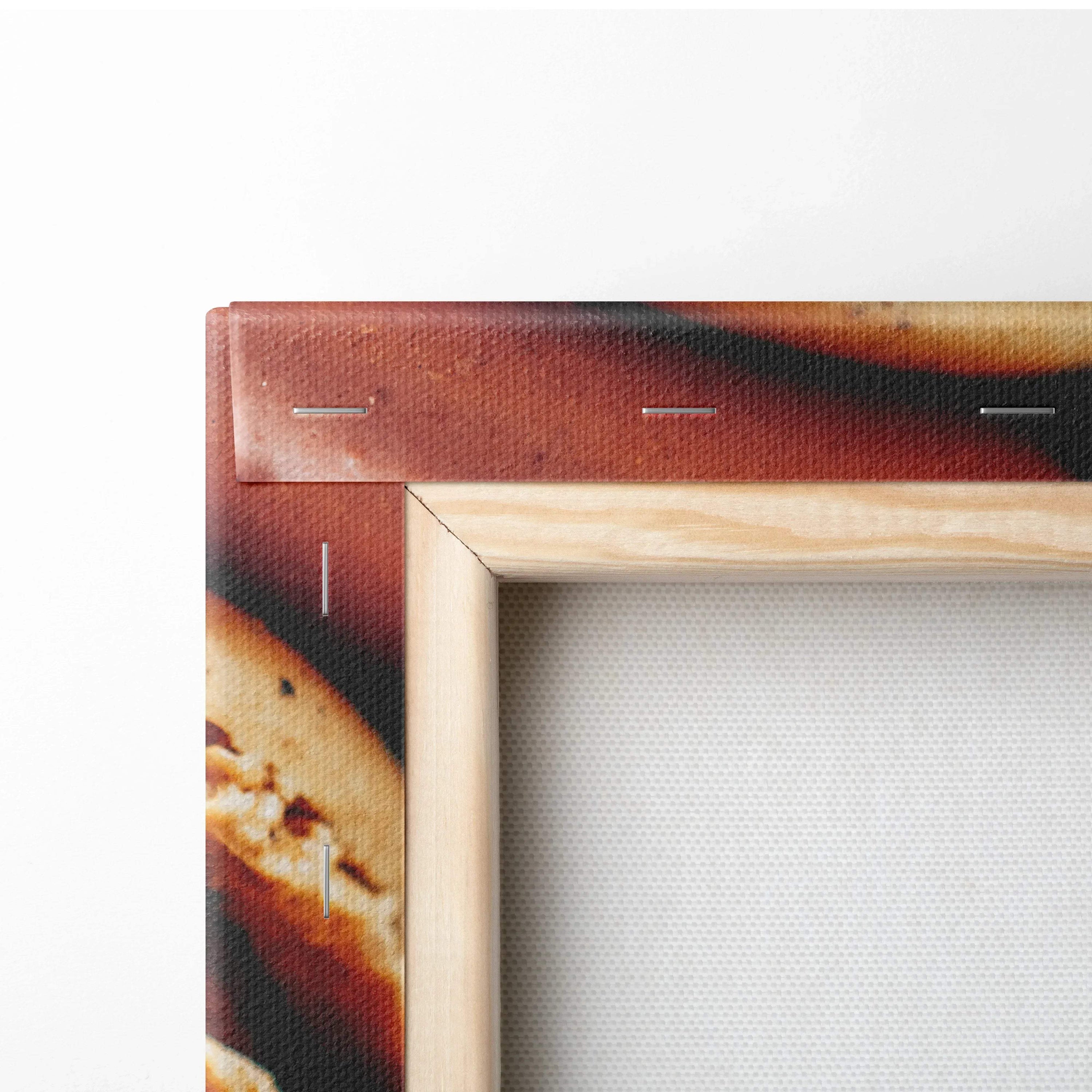 Close-up of wooden frame corner on canvas wall art featuring baked cookies design with rich brown and golden tones.