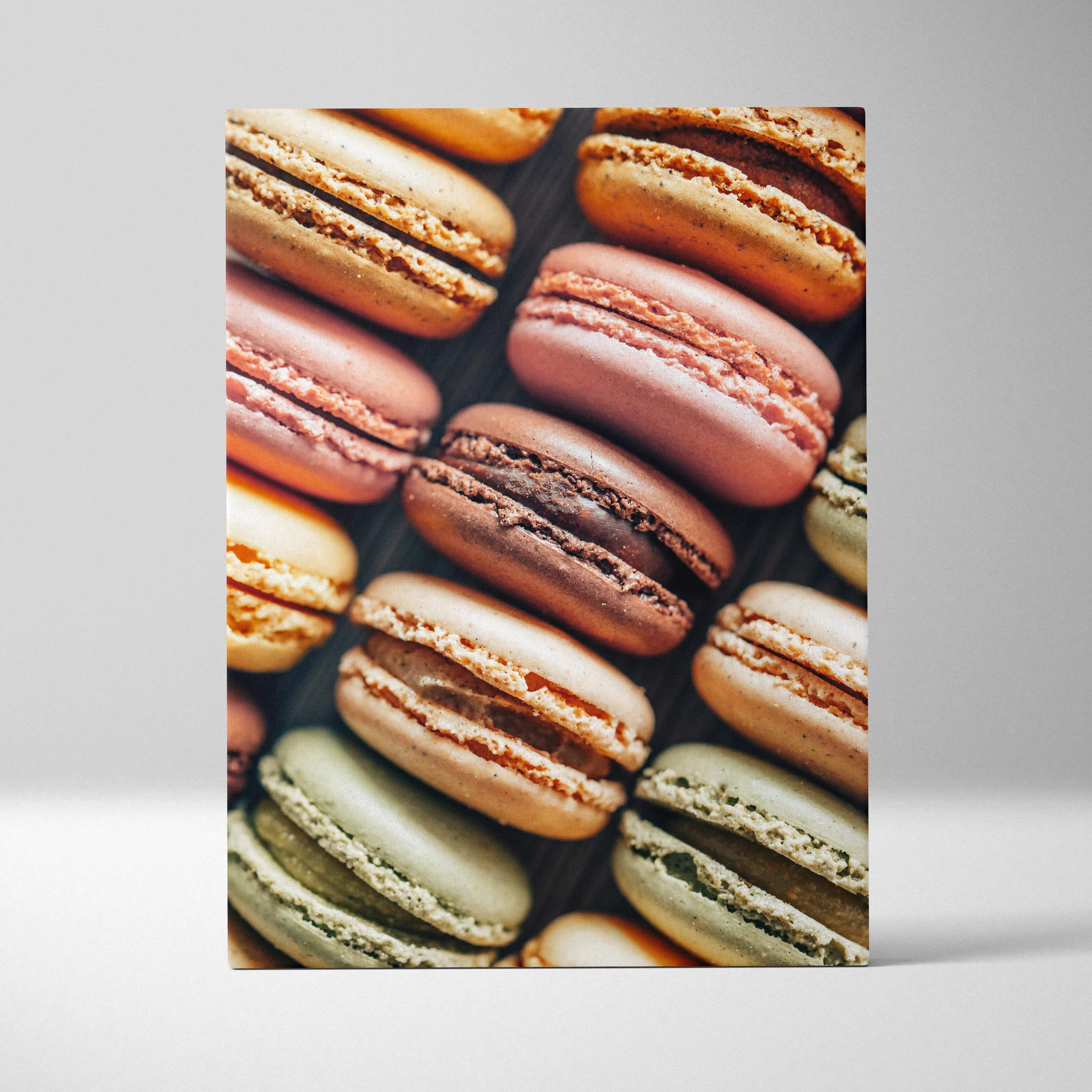Canvas wall art featuring close-up of colorful macarons in pastel shades for home decor.
