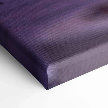 Close-up of purple gradient vertical canvas art with textured surface and wrapped edges wall art.