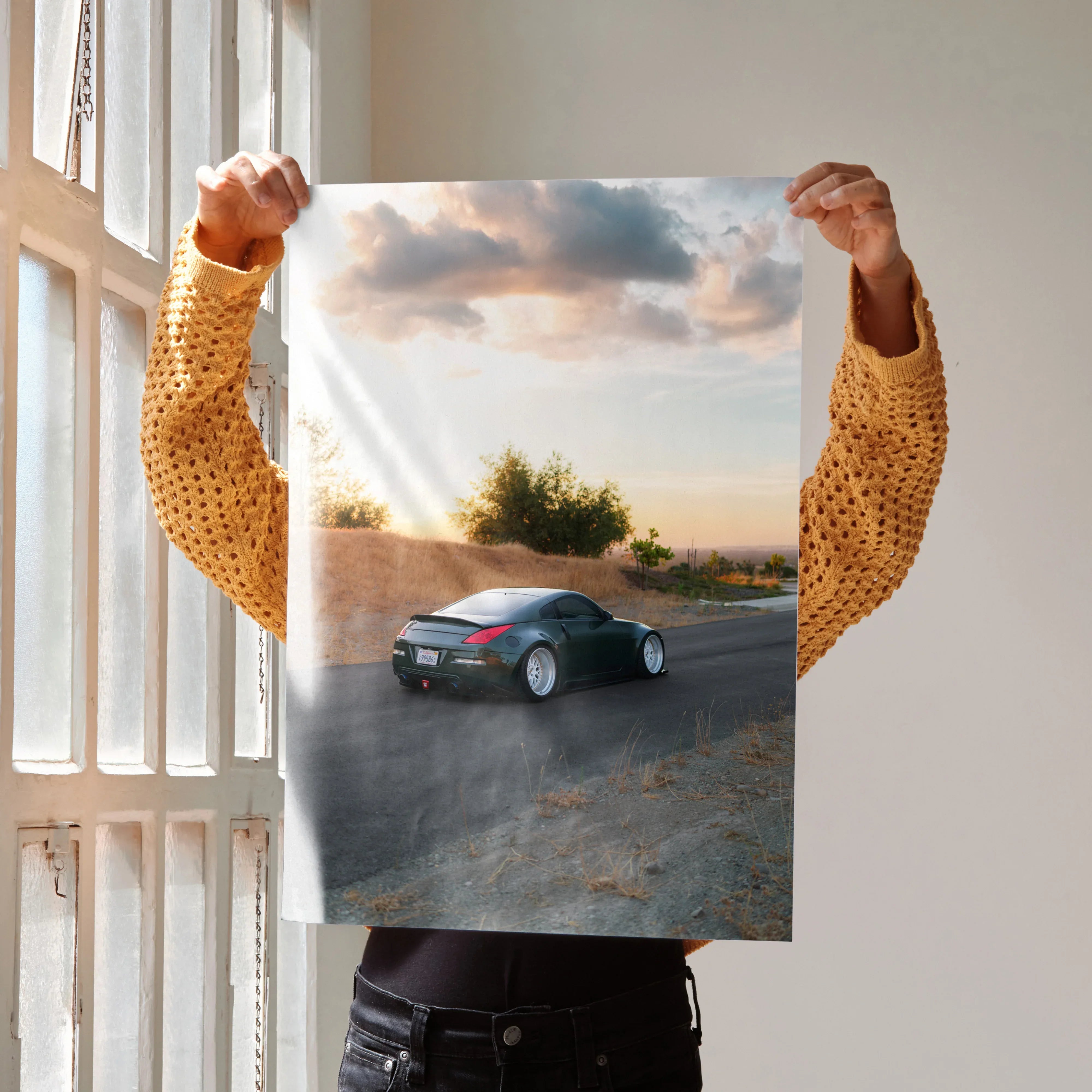 Nissan 350z car poster showing black sports car on road at sunset wall art.
