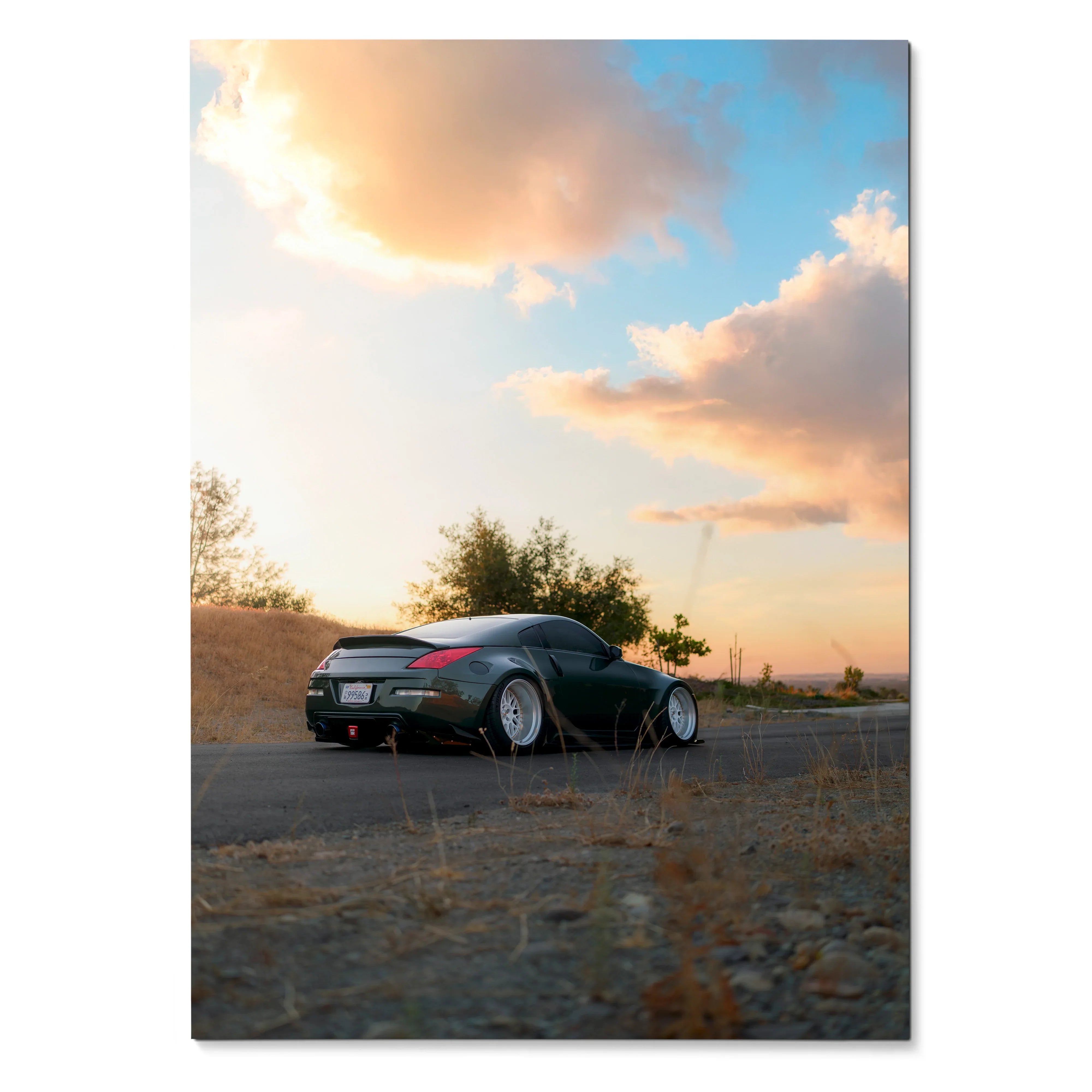 Nissan 350z poster showing rear view with wide wheels against sunset sky wall art.