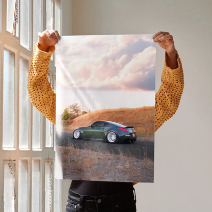 Nissan 350z car driving on a rural road at sunset poster wall art in soft, natural tones.