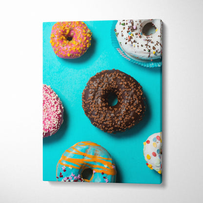 Canvas wall art featuring colorful donuts with sprinkles on a bright turquoise background for kitchen decor.