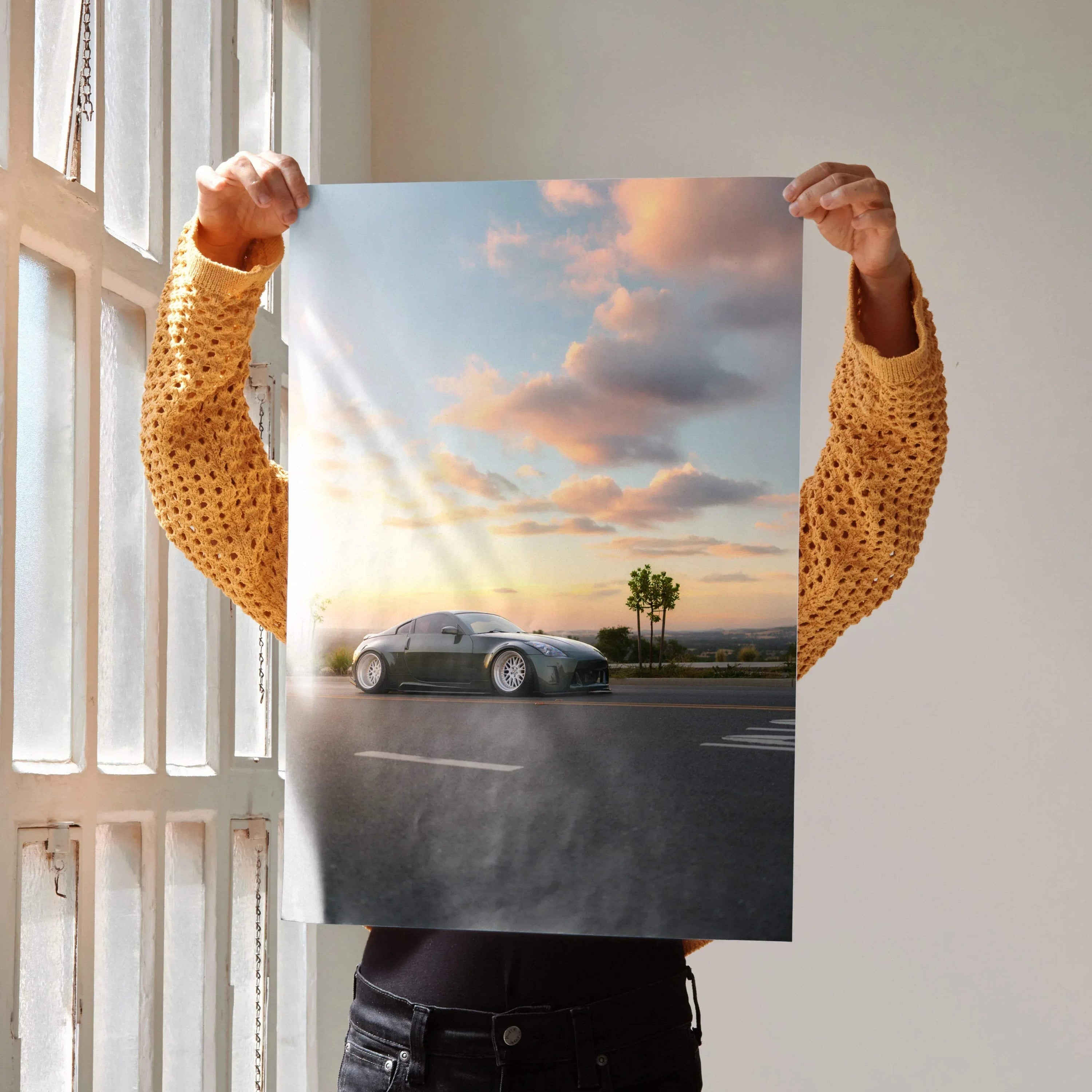 Nissan 350z poster wall art with car on road at sunset and palm tree background.
