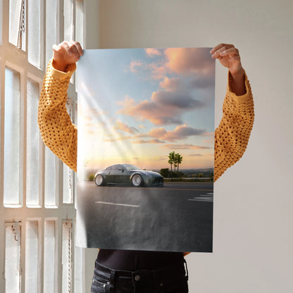 Nissan 350z poster wall art with car on road at sunset and palm tree background.