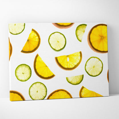 Canvas wall art featuring vibrant yellow lemon and green lime slices scattered on a white background for kitchen decor.