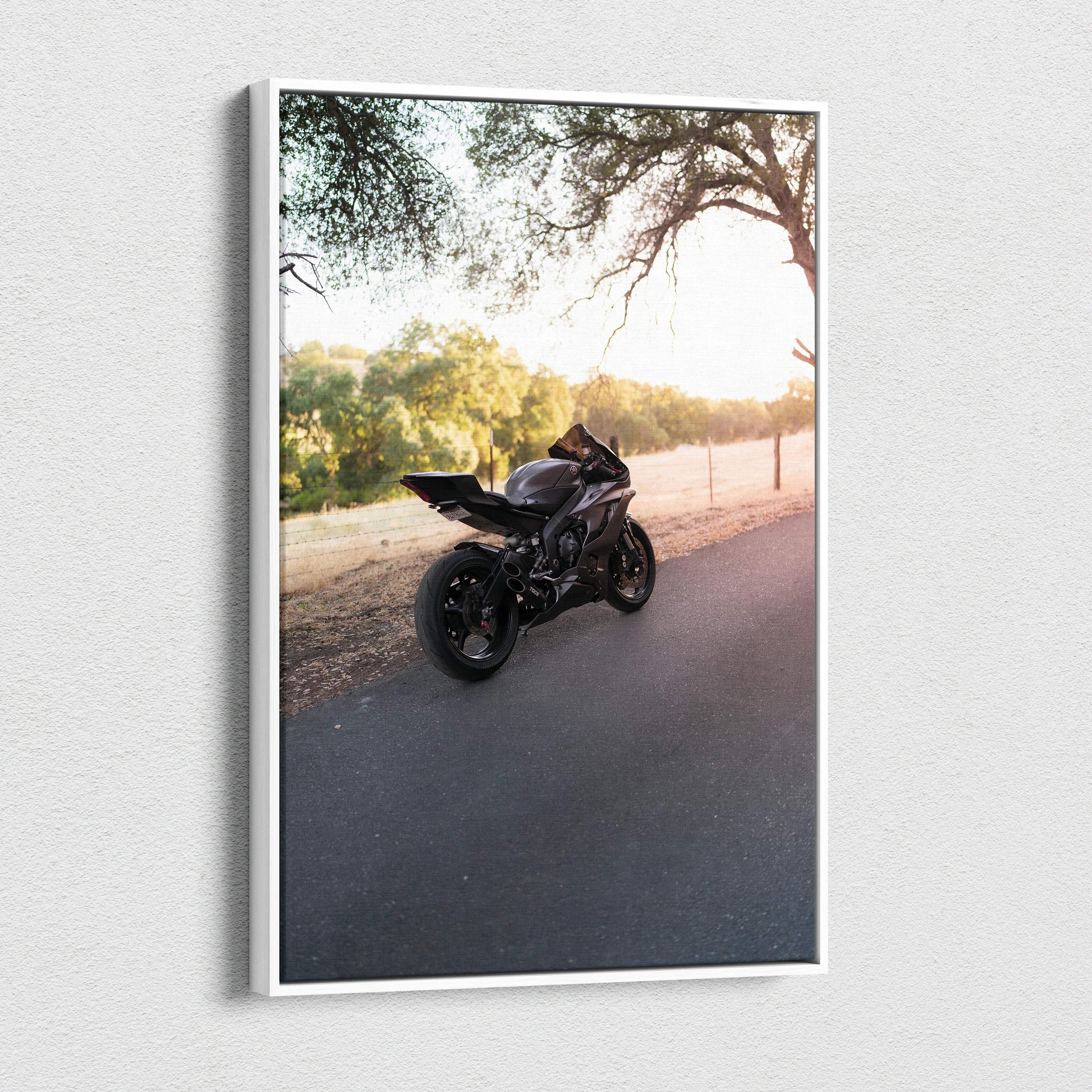 Black Yamaha R6 motorcycle on road at sunset canvas wall art vertical print.