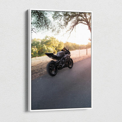 Black Yamaha R6 motorcycle on road at sunset canvas wall art vertical print.