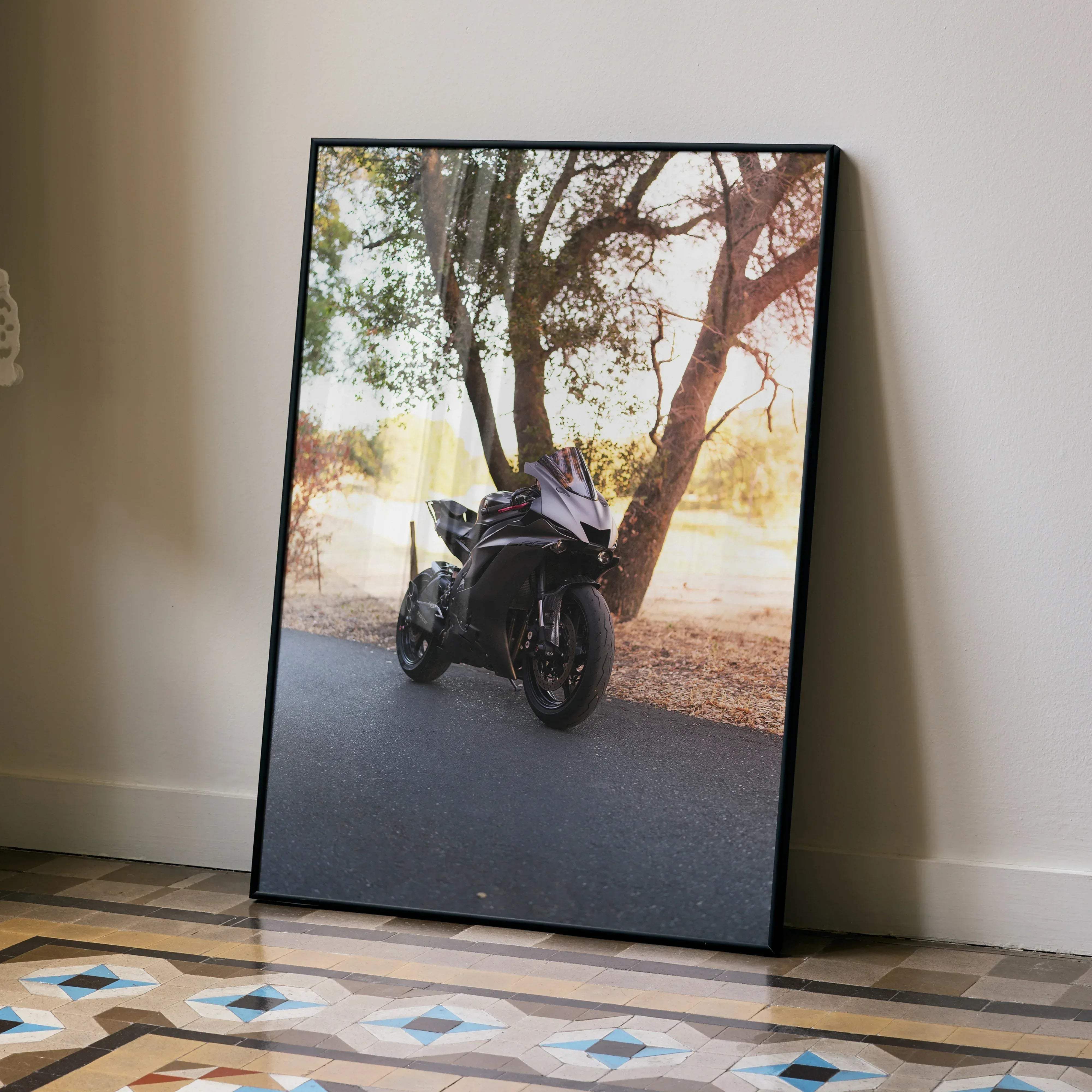 Black framed Yamaha R6 motorcycle poster featuring a sleek sportbike parked under trees in a natural setting