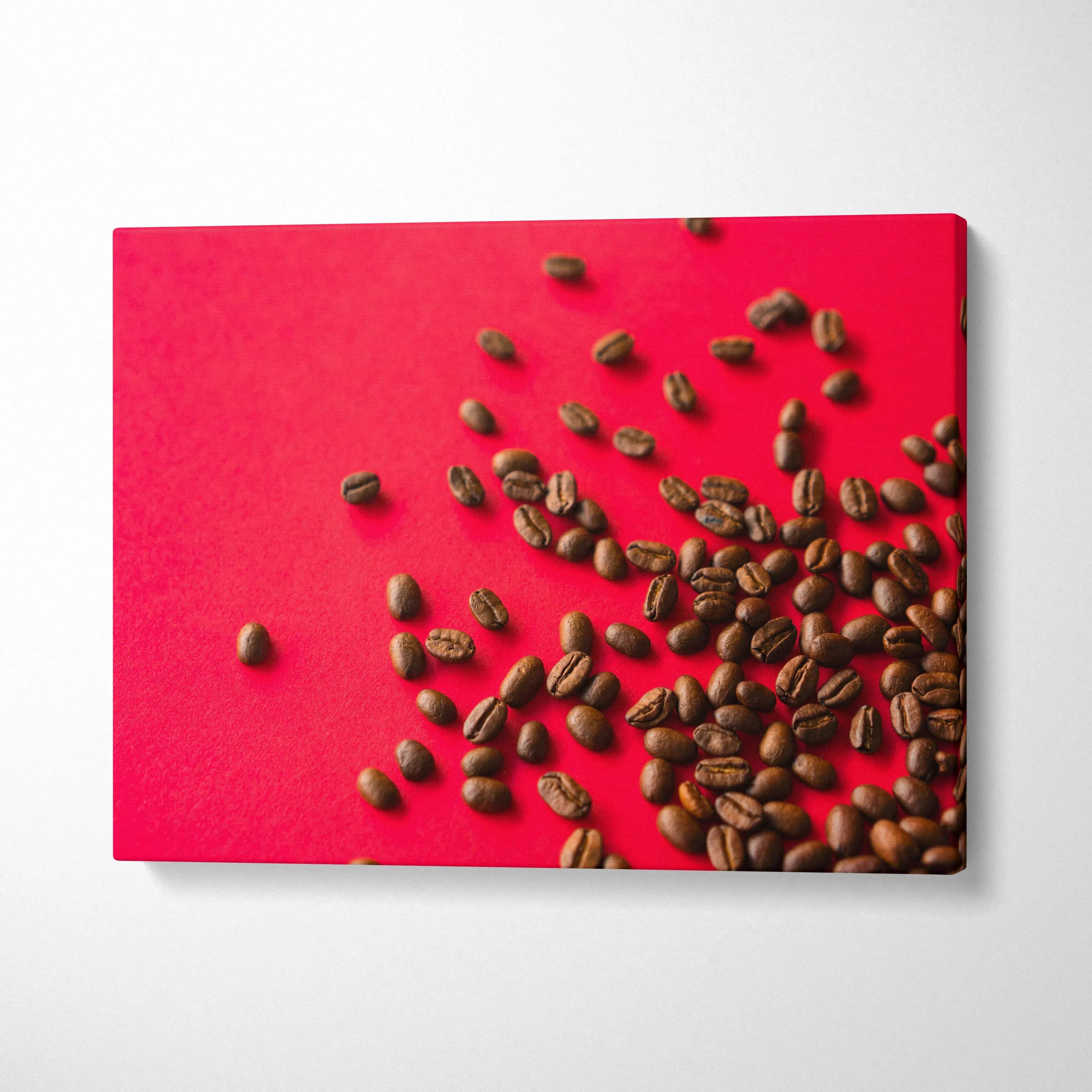 Canvas wall art featuring high-resolution coffee beans scattered on vibrant red background for home decor.