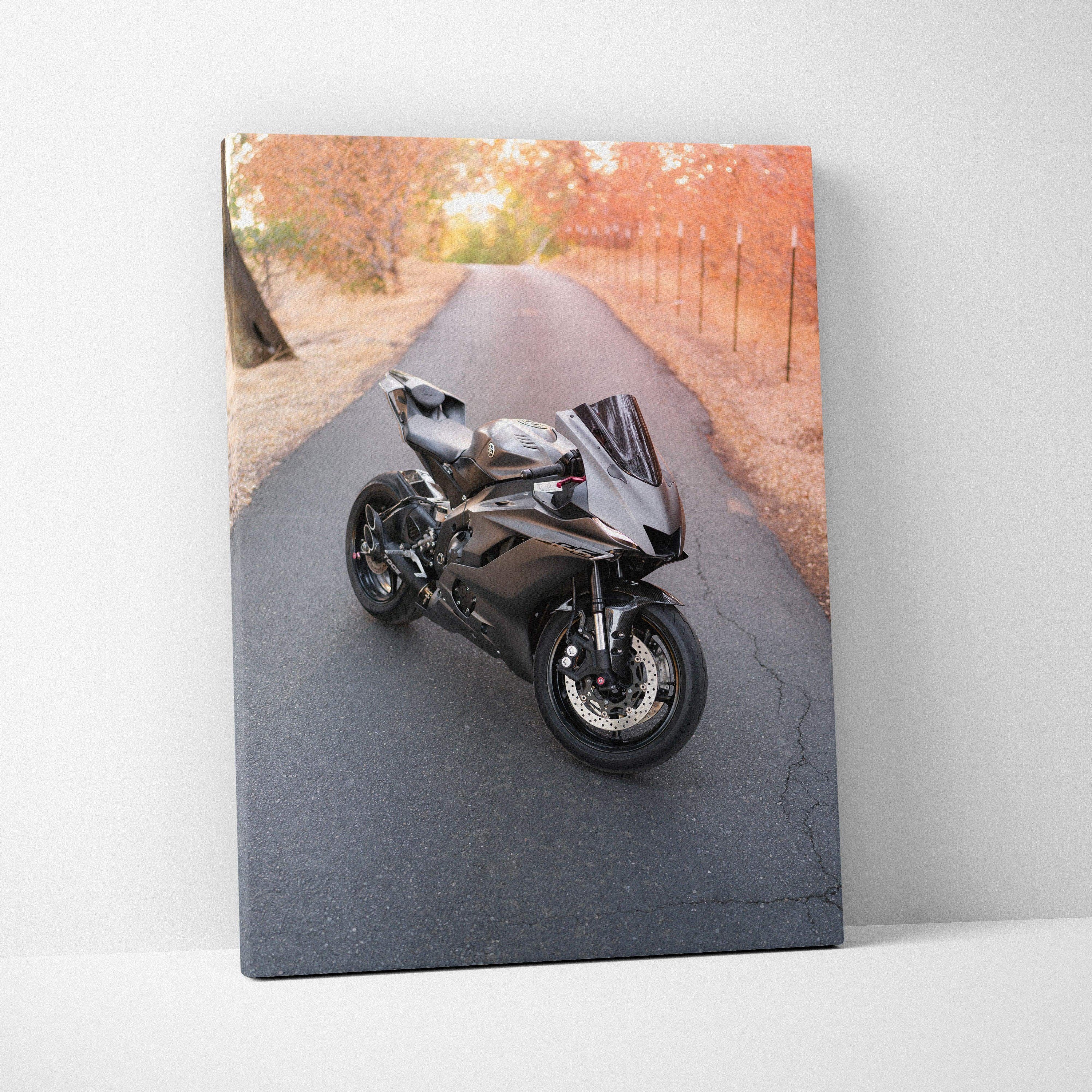 Yamaha R6 motorcycle on autumn road canvas wall art with vibrant fall colors vertical orientation.