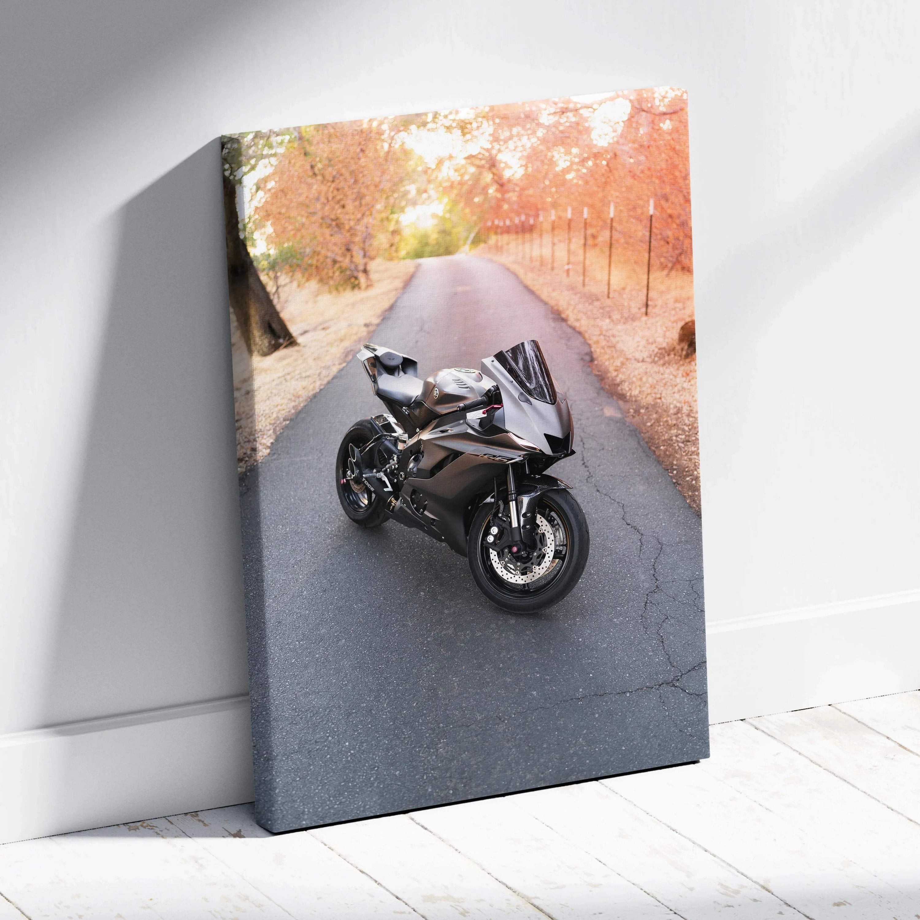 Black Yamaha R6 motorcycle on autumn road canvas wall art in vertical format.