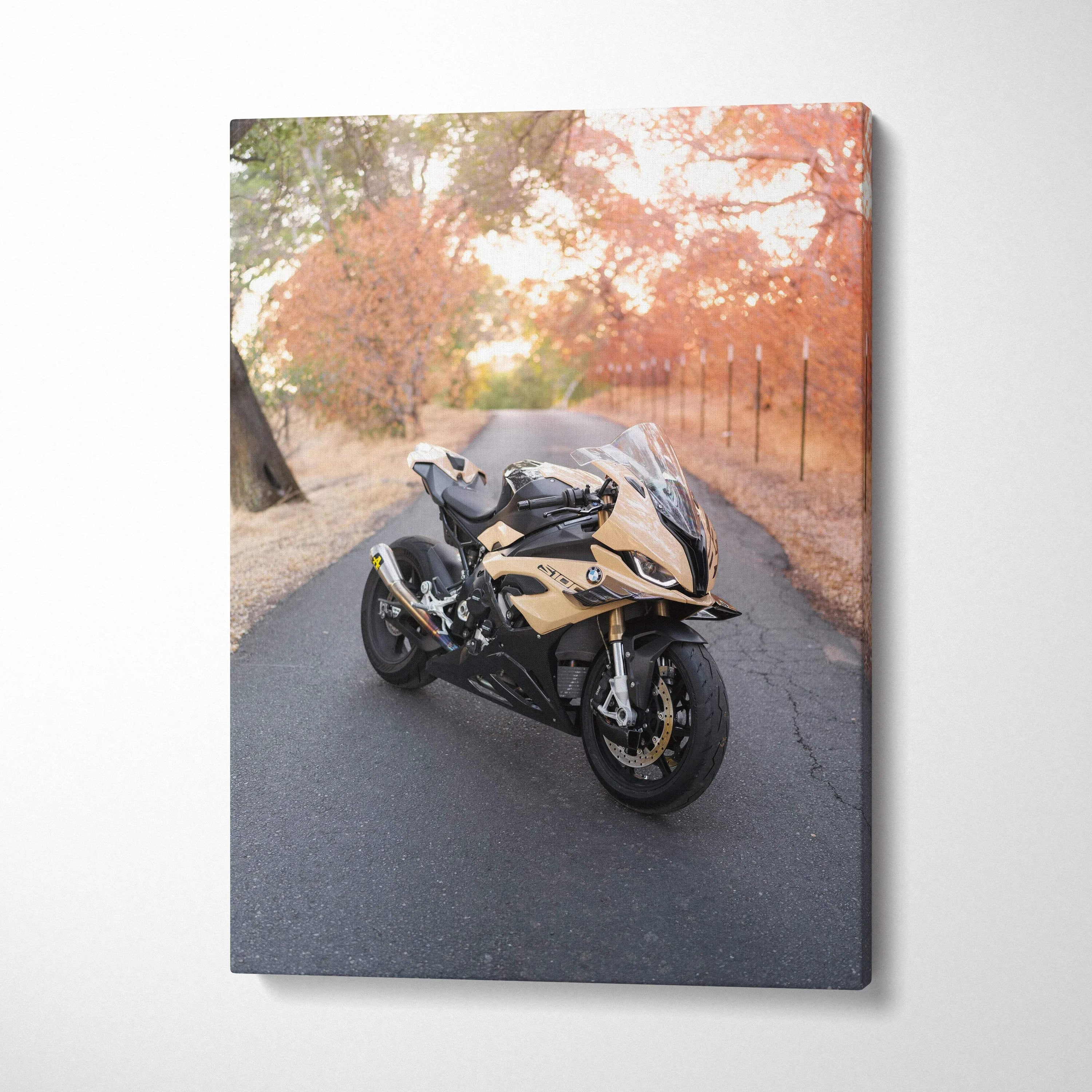 Vertical canvas wall art featuring a gold and black BMW S1000RR motorcycle on an autumn road.