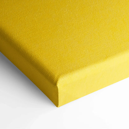 Close-up of bright yellow canvas wall art corner with textured fabric and clean edges.