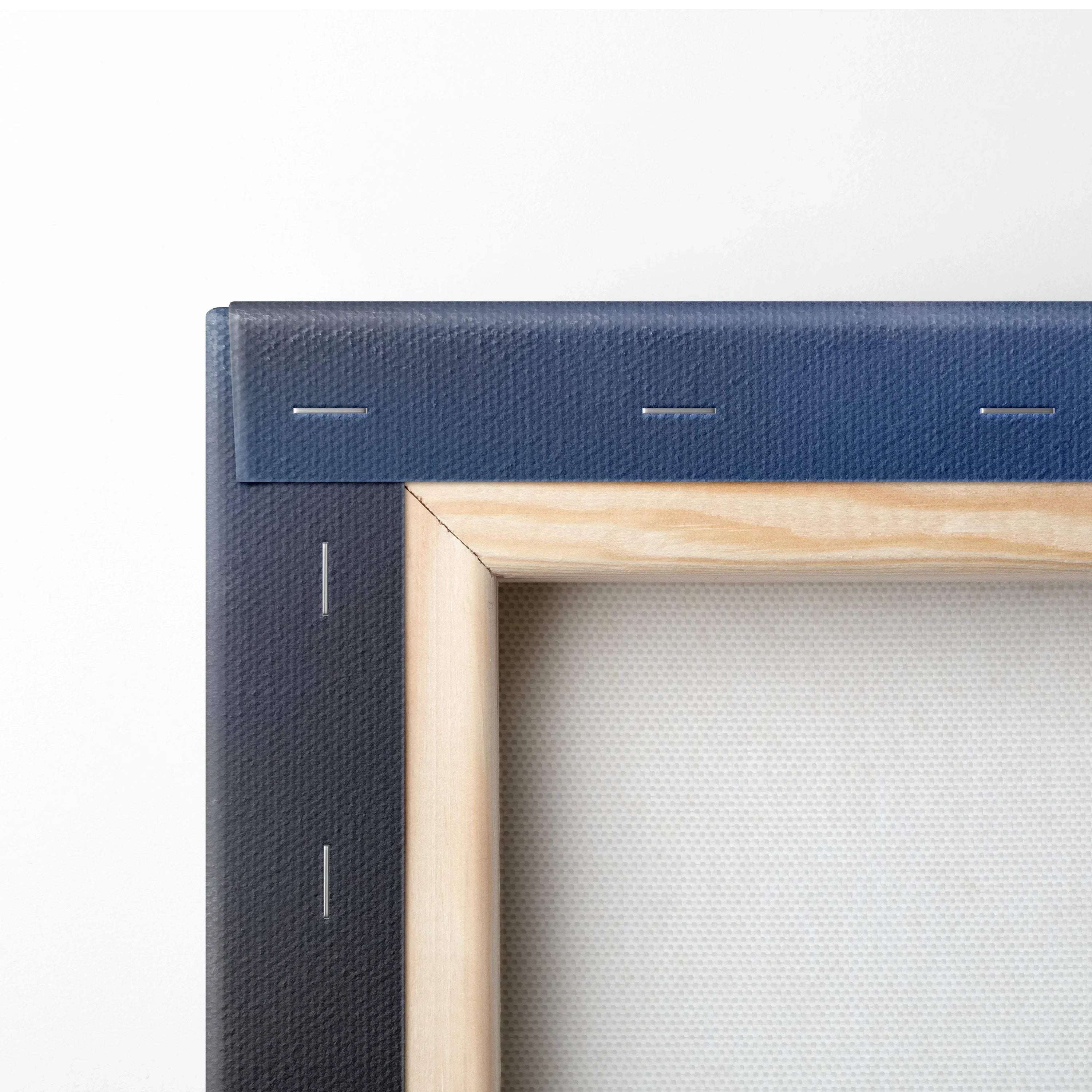 Close-up of stretched canvas on wooden frame corner with fabric texture for wall art canvas print.