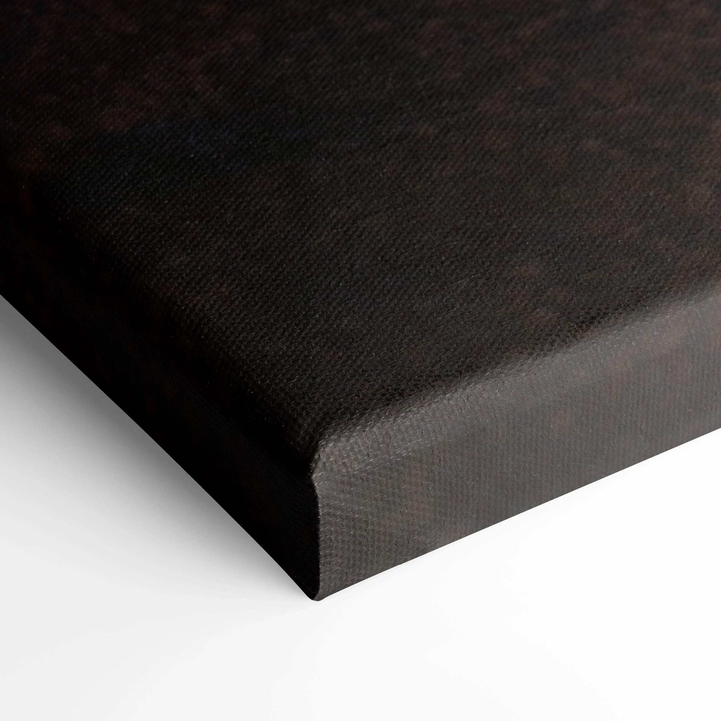 Black wrapped edge of vertical canvas art with textured surface for wall art display.