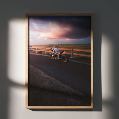 BMW R Nine T motorcycle parked near wooden fence at sunset poster wall art in wooden frame.