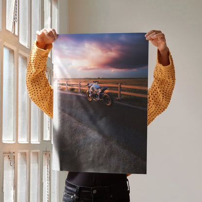 BMW R Nine T motorcycle parked by wooden fence at sunset poster wall art with dramatic sky.