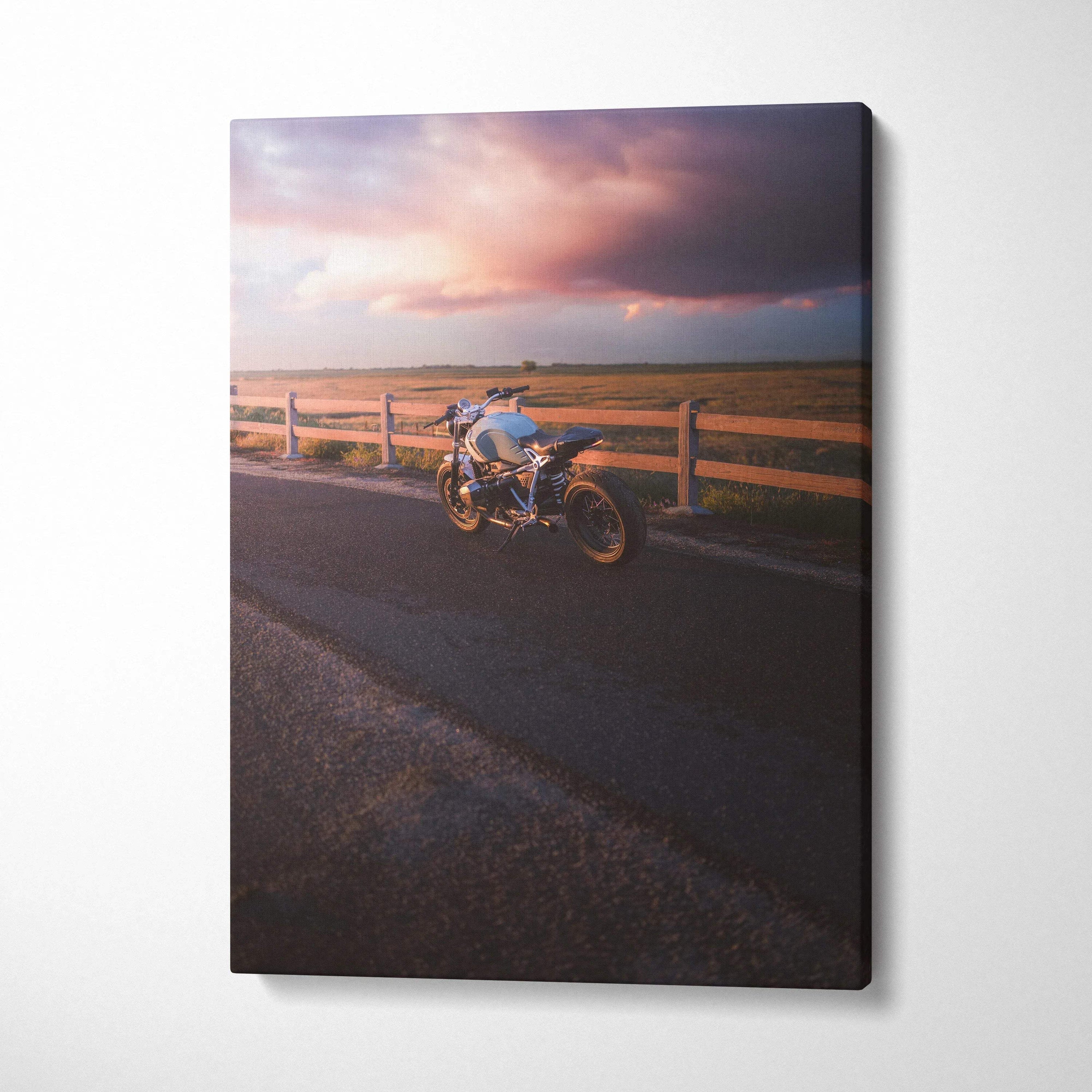 BMW R Nine T motorcycle parked by wooden fence under dramatic sunset sky canvas wall art.