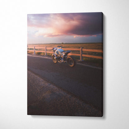 BMW R Nine T motorcycle parked by wooden fence under dramatic sunset sky canvas wall art.